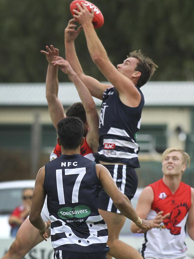 Nick Mott (marking) kicked five goals on Saturday. Picture: AAP/Dean Martin