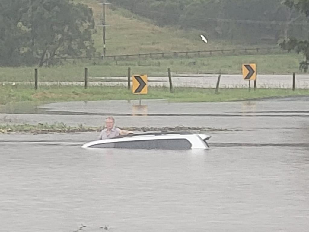 A North Coast man was rescued from the roof of his car in rising floodwaters by Keith Graham on Boatharbour Road out of Lismore on Friday. Picture: Keith Graham