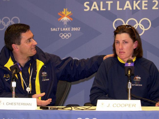 Chef de Mission Ian Chesterman comforts injured aerial skier Jacqui Cooper at the 2002 Games.