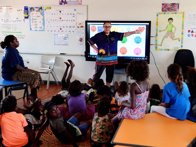 Minyerri School students are taught math during a lesson on Thursday in the community. Picture: Justin Kennedy