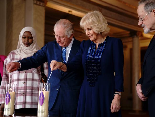 King Charles III and Camilla, Queen Consort light a candle at Buckingham Palace to mark Holocaust Memorial Day. Picture: WPA Pool/Getty Images