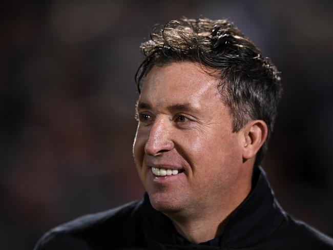 Brisbane Roar coach is all smiles as his men take control of the game. Picture: AAP Image/Joel Carrett