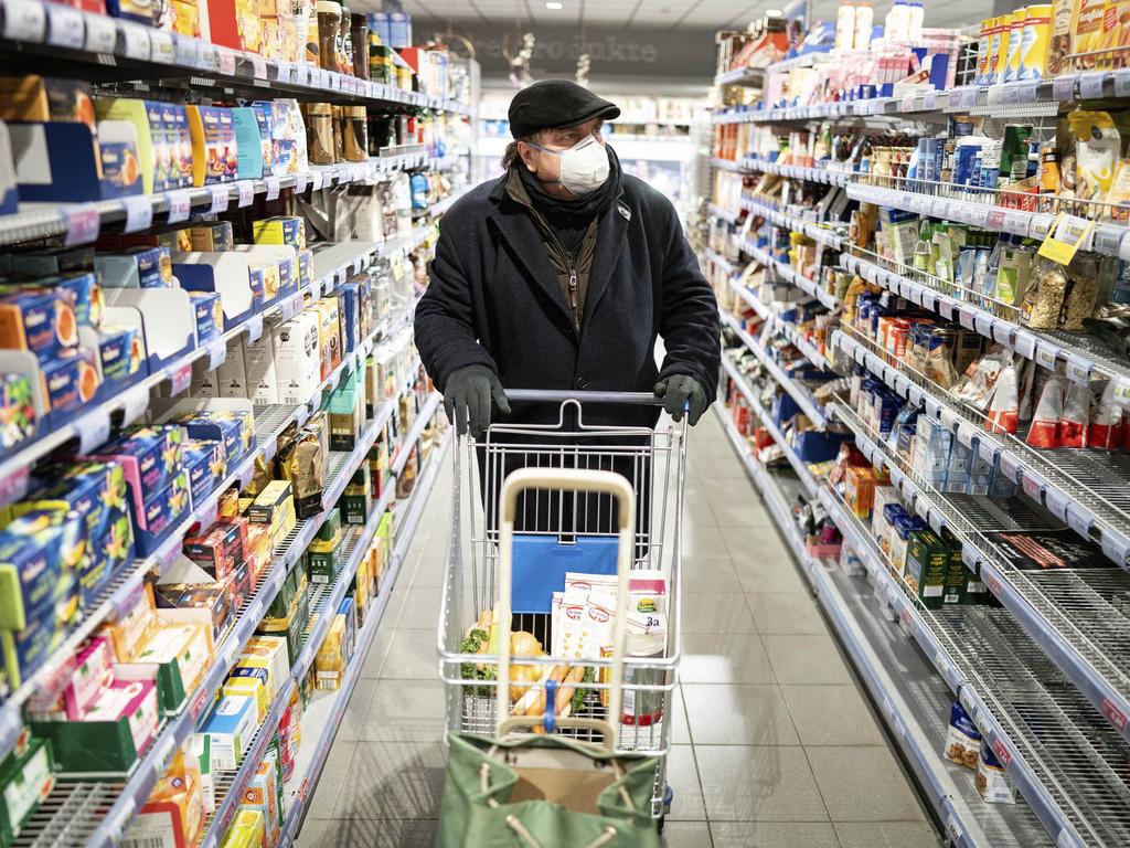 The coronavirus has been proven to live up to several days on surfaces such as tinned food and fresh vegetables. Picture: Kay Nietfeld/dpa via AP