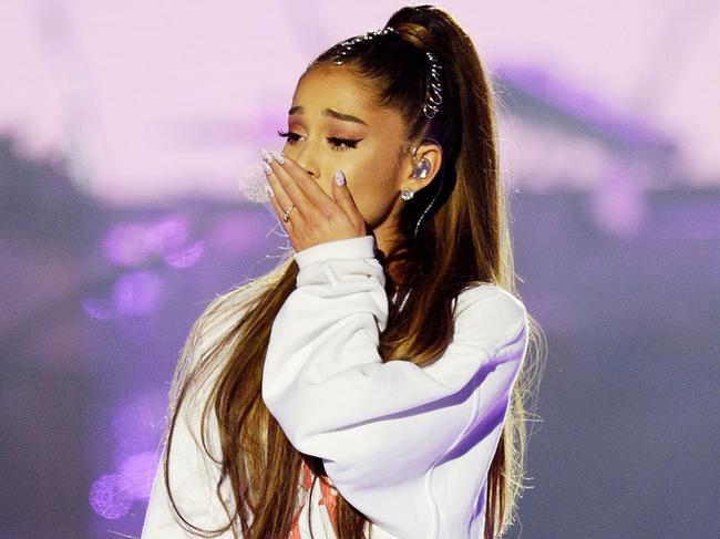 In this Sunday, June 4, 2017, handout photo provided by Dave Hogan for One Love Manchester, singer Ariana Grande is overcome by emotion at the One Love Manchester tribute concert in Manchester, north western England, Sunday, June 4, 2017. One Love Manchester is raising money for those affected by the bombing at the end of Ariana Grande's concert in Manchester on May 22, 2017. (Dave Hogan via AP)