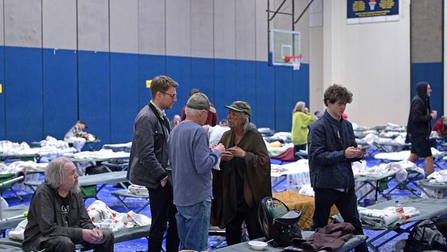 Evacuees from the Palisades fire are at an evacuation and shelter centre at Westwood Recreation Center in Los Angeles, California. Picture: Agustin Paullier/AFP