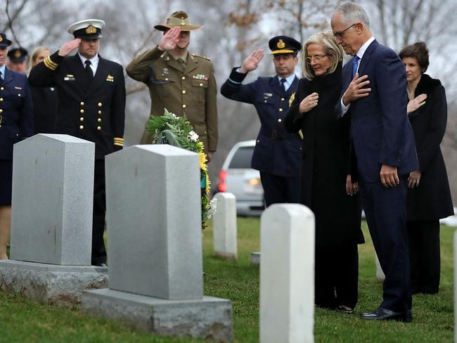 ARLINGTON, VA - FEBRUARY 22: Australian Prime Minister Malcolm Turnbull (R) and his wife Lucy Turnbull observe a moment of silence after laying a wreath the grave of Royal Australian Air Force Pilot Francis D. Milne at Arlington National Cemetery February 22, 2018 in Arlington, Virginia. Milne went missing in action on November 26, 1942 while serving with a U.S. aircrew during World War II. Because his remains could not be distingushed from those of Army Air Corps Technical Sergeant Joseph E. Paul, they are buried together.   Chip Somodevilla/Getty Images/AFP == FOR NEWSPAPERS, INTERNET, TELCOS & TELEVISION USE ONLY ==