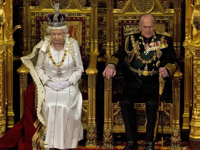 Queen Elizabeth II sits next to Prince Philip in the House of Lords as she waits to read the Queen's Speech to lawmakers in London. Picture: AP