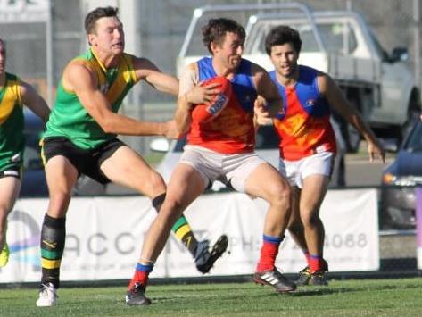 Mulgrave footballer Tim Knowles looks to evade traffic in the Eastern Football League (EFL). Picture: Ashlee Bieniak