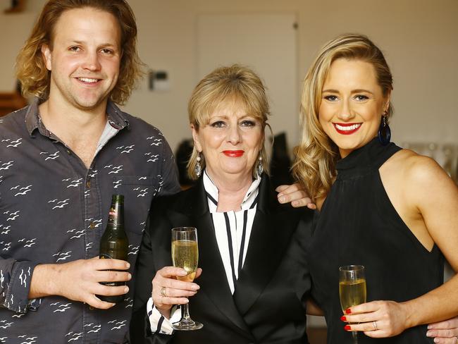 Debi Marshall, centre, with her daughter’s husband Dave Houbaer, left, daughter Louise Houbaer, right. Picture: MATT THOMPSON