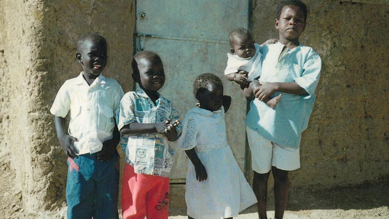 Daw (right) fled his hometown in Sudan as a child, in the middle of the night, with his family. Picture: Supplied