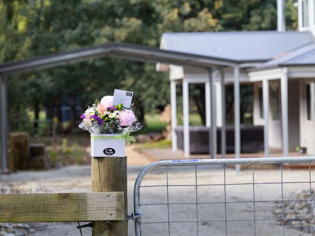 Flowers left at the front of Ms Patterson’s home following the death of her former parents-in-law. Picture: Jason Edwards