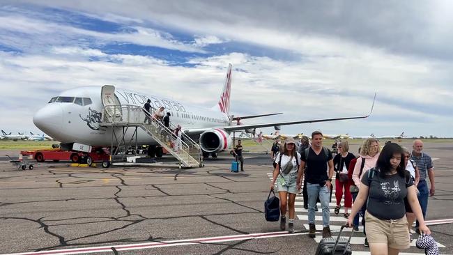 Tourist and passengers arrive at Alice Springs airport in January.