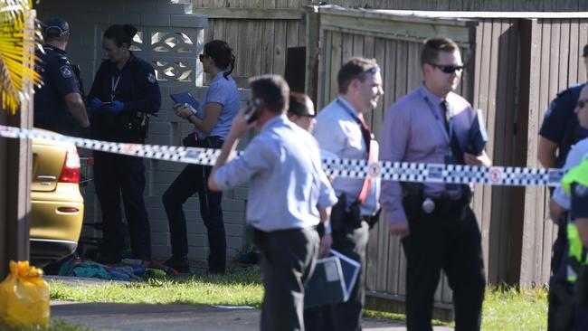 Police interview a woman at the scene of the shooting in Labrador. Photo: Regi Varghese