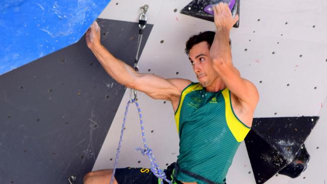 Campbell Harrison built a climbing wall in his backyard shed with the help of his parents. Picture: supplied