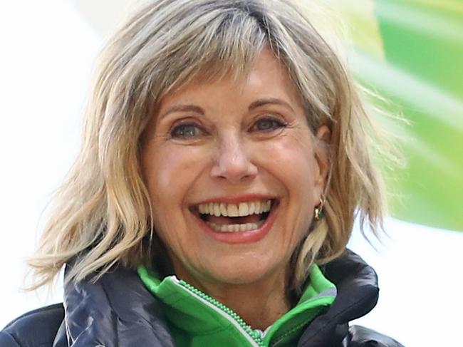 MELBOURNE, AUSTRALIA - SEPTEMBER 16:  Olivia Newton-John encourages walkers during the annual Wellness Walk and Research Runon September 16, 2018 in Melbourne, Australia. The annual event, now in it's sixth year, raises vital funds to support cancer research and wellness programs at the Olivia Newton-John Cancer Wellness and Research Centre in Victoria.  (Photo by Scott Barbour/Getty Images)