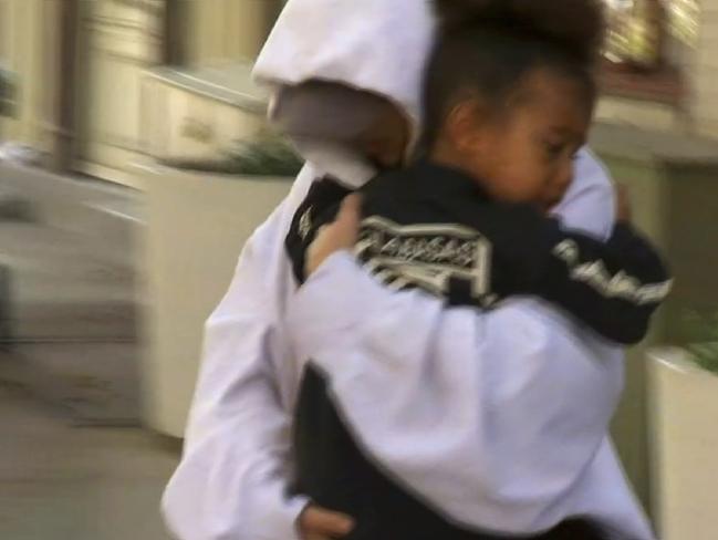 Kim Kardashian West leaves a New York apartment with her daughter North West. Picture: AP Photo/Zoran Drakulic.