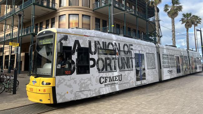 The other side of the tram, which has been emblazoned with CFMEU advertising. Picture: Jo Schulz