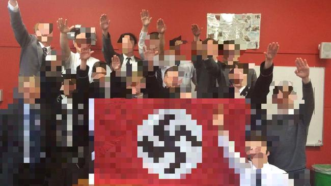 2016 graduating Year 12 students at Shore Grammar posing with a Nazi flag.