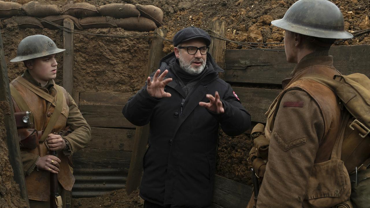 Sam Mendes on set in the trenches with Dean-Charles Chapman (left) and George MacKay (right). Picture: Francois Duhamel/Universal Pictures via AP