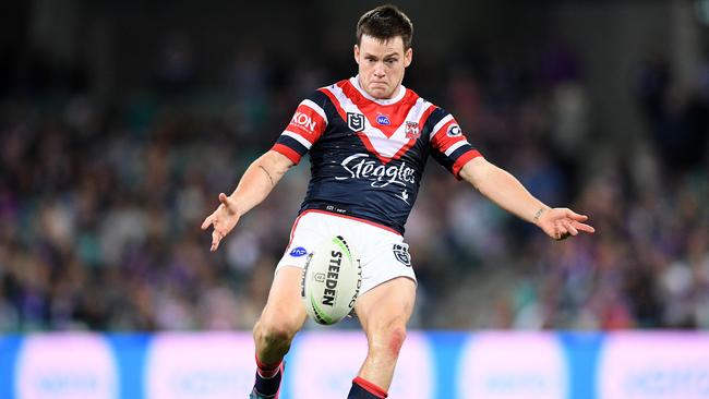 Luke Keary gets a kick away for the Roosters. Picture: AAP