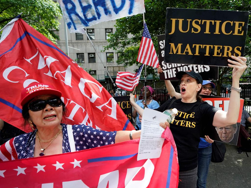 Supporters and opponents of Mr Trump outside the Manhattan Criminal Court. Picture: AFP