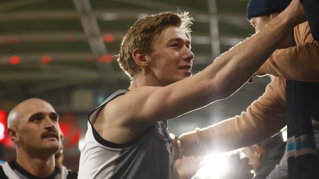 MELBOURNE, AUSTRALIA - AUGUST 14: Todd Marshall of the Power celebrates with fans after winning the round 22 AFL match between the Essendon Bombers and the Port Adelaide Power at Marvel Stadium on August 14, 2022 in Melbourne, Australia. (Photo by Daniel Pockett/Getty Images)