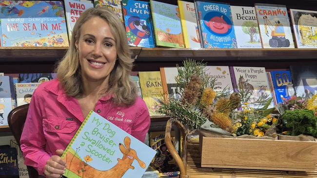 Karen McKinley in bookstore with her new children's book. Picture - contributed.