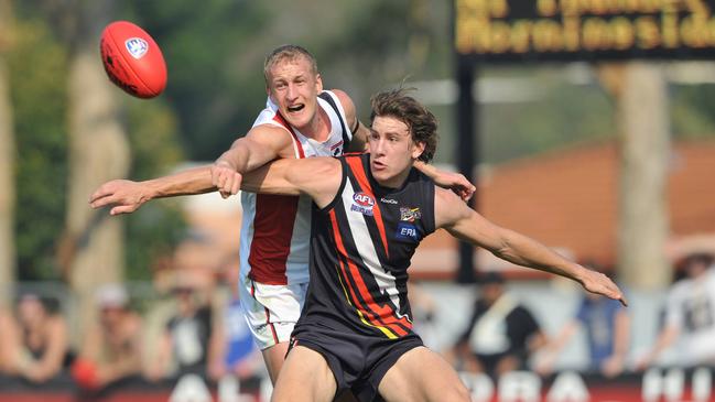 NEAFL Grand Final at Victoria Point in Brisbane. NT Thunder v Morningside. Thunders Shaun Tapp competes with Jacob Gough.