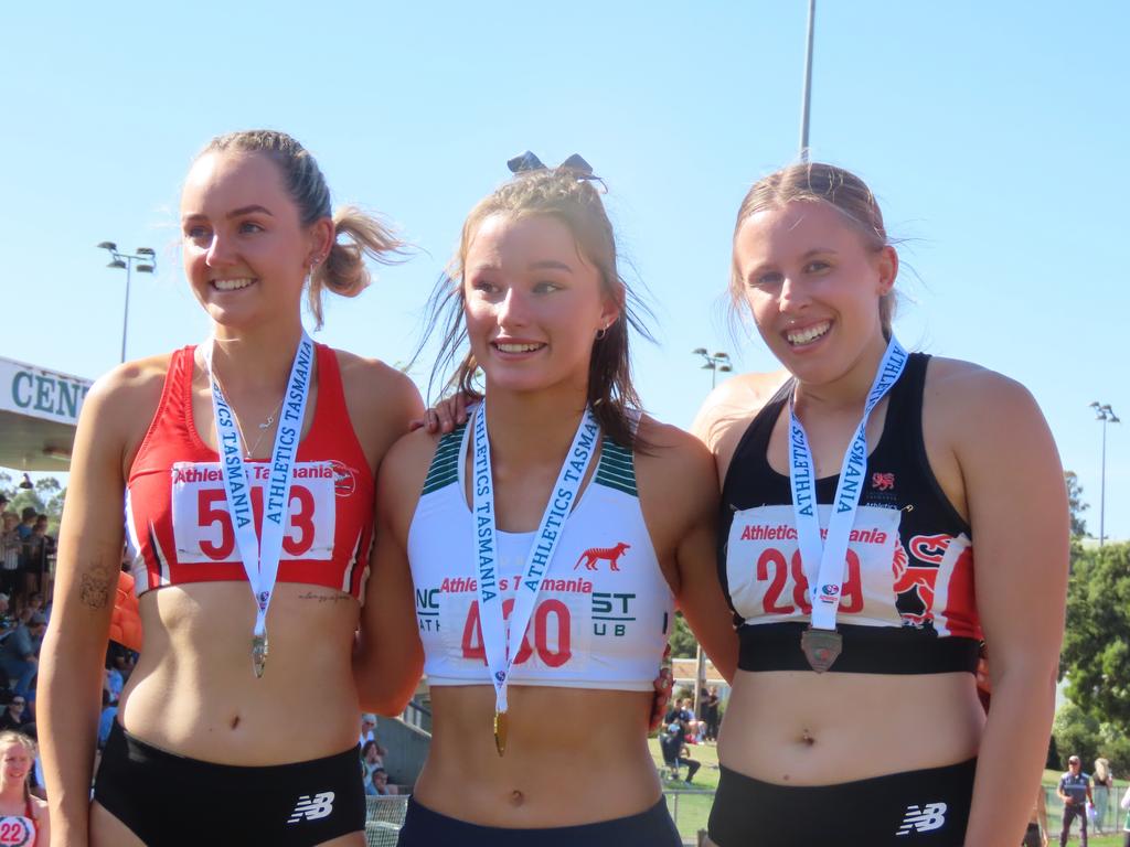 Podium getters Kiana Allen (bronze, Eastern Suburbs), Chelsea Scolyer (gold, North West) and Bec Kovacic (bronze, Uni of Tas) after the 100m open final at the Tasmanian Track and Field Championships in Launceston on the weekend. Picture: Jon Tuxworth