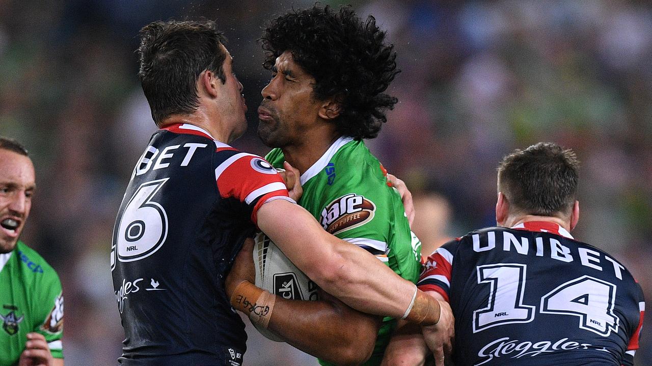 Iosia Soliola of the Raiders is tackled by Nat Butcher and Angus Crichton.