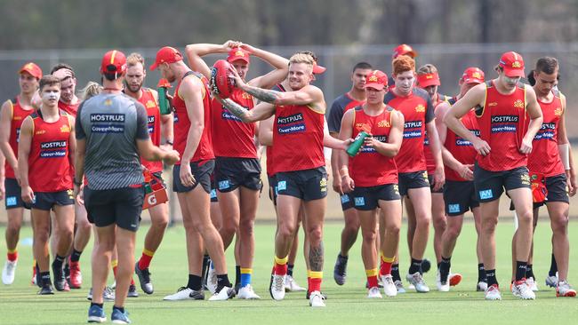 Brandon Ellis handballs during a Gold Coast training session in December. Picture: Chris Hyde/AFL Photos