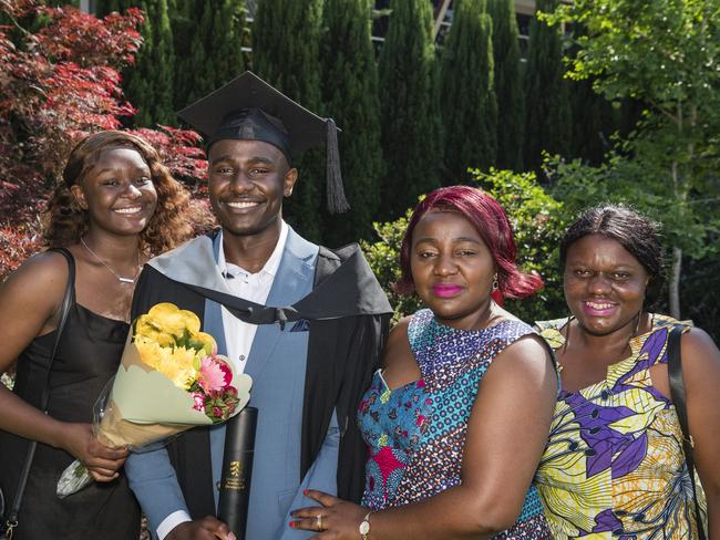 Bachelor of Business graduate Meschac Ungala with family (from left) Lydia Kitambo Ungala, Esperance Kabanda Musa and Denis Mbusa at a UniSQ graduation ceremony at Empire Theatres, Tuesday, October 31, 2023. Picture: Kevin Farmer