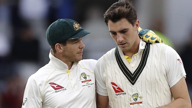 Tim Paine speaks to Pat Cummins on day five of the Fourth Test at Old Trafford Picture: Getty Images