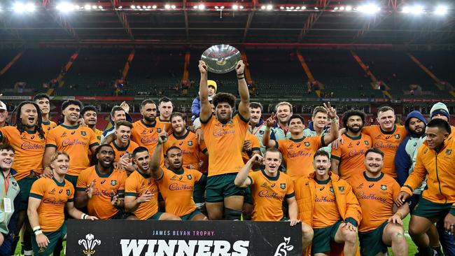 CARDIFF, WALES - NOVEMBER 17: Rob Valetini of Australia lifts the James Bevan Trophy as players of Australia celebrate victory after defeating Wales during the Autumn Nations Series 2024 match between Wales and Australia at the Principality Stadium on November 17, 2024 in Cardiff, Wales. (Photo by Dan Mullan/Getty Images)