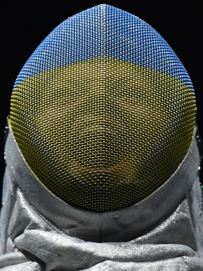 Ukraine's Olena Kravatska reacts as she competes against US Ibtihaj Muhammad during their women’s individual sabre qualifying bout as part of the fencing event of the Rio 2016 Olympic Games, on August 8, 2016, at the Carioca Arena 3, in Rio de Janeiro. / AFP PHOTO / Kirill KUDRYAVTSEV