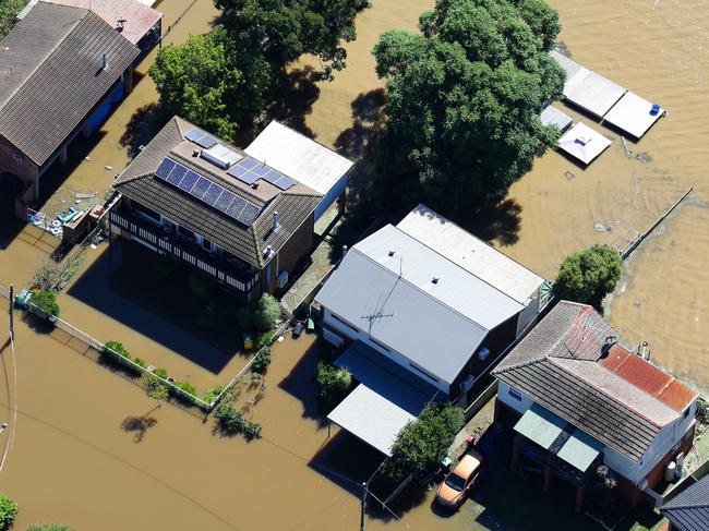 SYDNEY, AUSTRALIA - NewsWire Photos MARCH 24, 2021: An Aerial view of the North Richmond in the Western Sydney region where devastating floods have hit the area. Homes are underwater with the front and backyards once grass now brown muddy water in Sydney, Australia. Picture: NCA NewsWire / Gaye Gerard