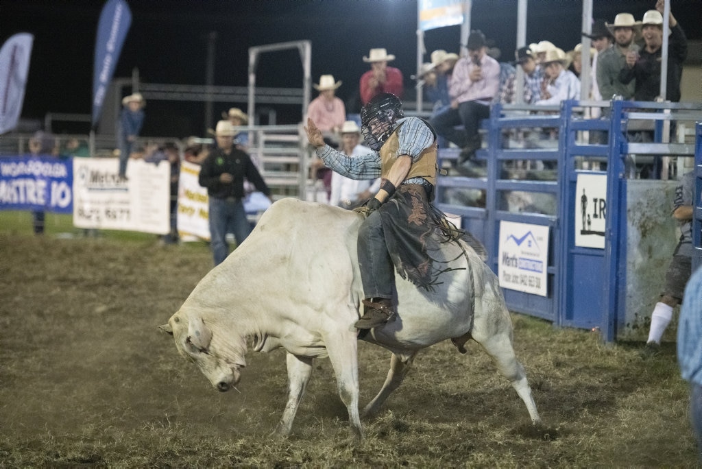 Matt Hollis concentrates in his junior bullride at the Lawrence Twilight Rodeo. Picture: Adam Hourigan