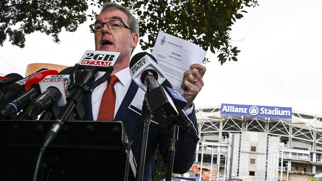 Michael Daley shows the PBO’s media release as he addresses the media outside Allianz Stadium this morning. Picture: Lukas Coch/AAP