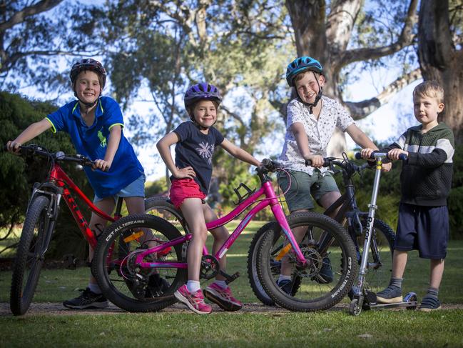 ADELAIDE, AUSTRALIA - ADVERTISER Photos NOVEMBER 21, 2021: Local kids Hamish 9yrs (blue shirt) with sister Imogen 7yrs and Michael 8yrs (white shirt) and little brother Henry 5yrs on their BMX Bicycles at the Gums Reserve, Shakespeare Ave, Tranmere. S.A. Picture Emma Brasier.