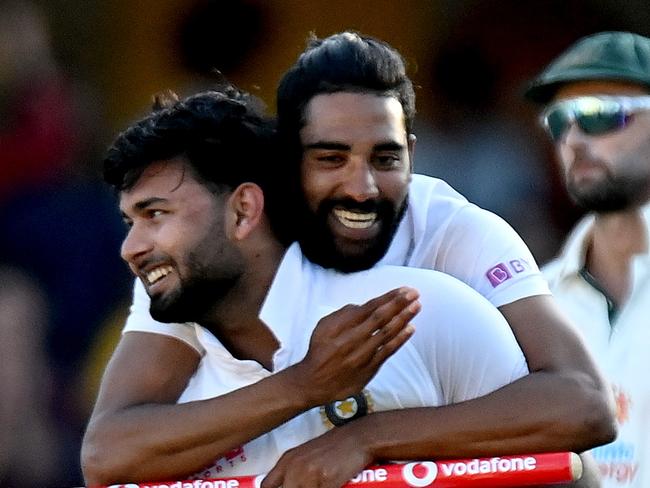 BRISBANE, AUSTRALIA - JANUARY 19: Rishabh Pant and Mohammed Siraj of India celebrate victory after day five of the 4th Test Match in the series between Australia and India at The Gabba on January 19, 2021 in Brisbane, Australia. (Photo by Bradley Kanaris/Getty Images) *** BESTPIX ***