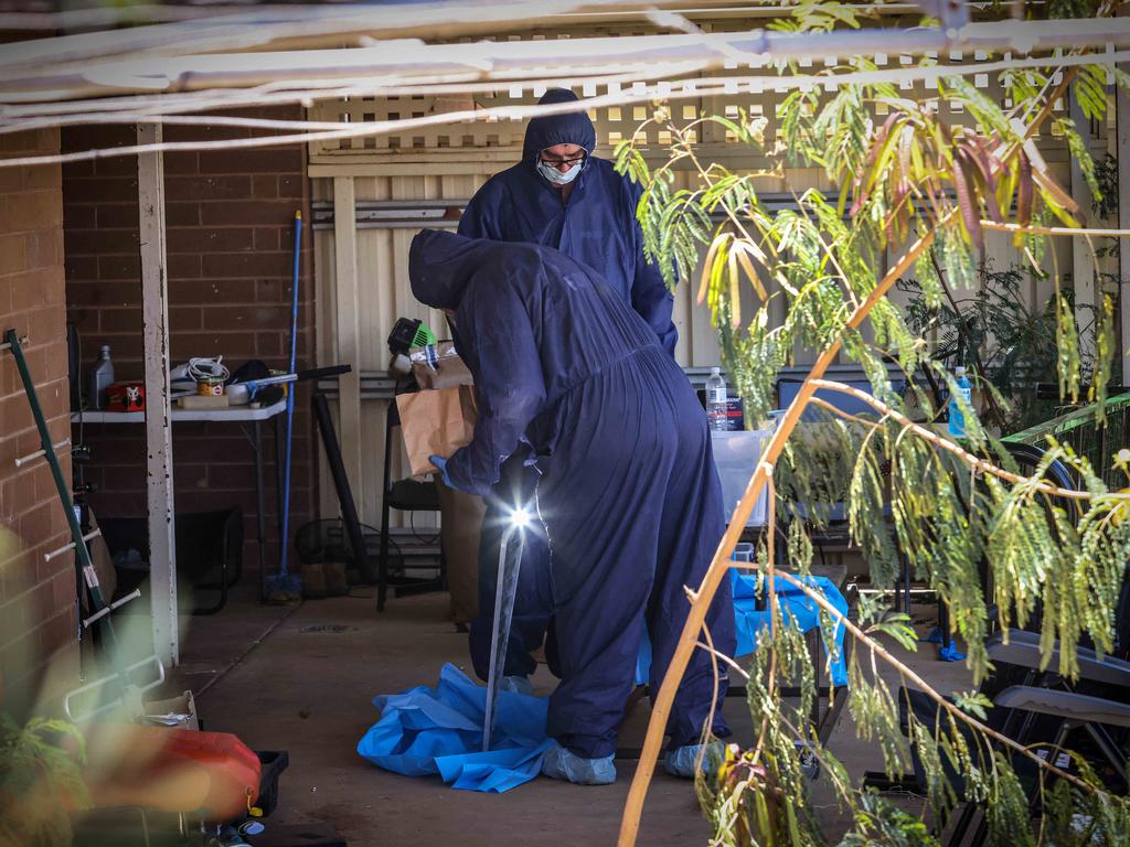 Forensic officers spent a long time scouring the house. Picture: Colin Murty