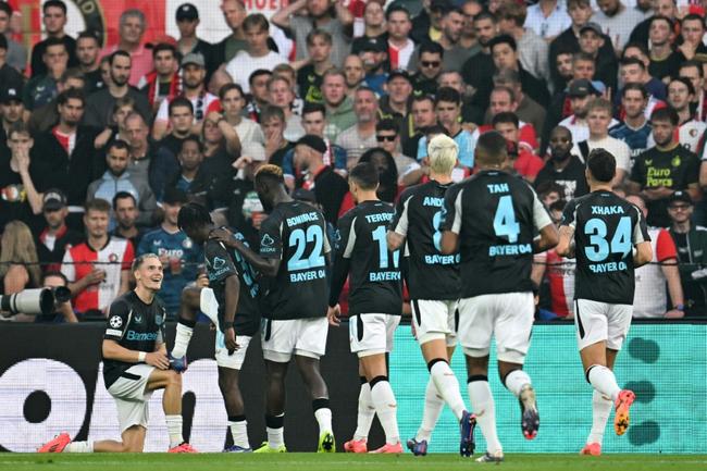 Florian Wirtz's (L) team-mates line up to celebrate his second goal during Bayer Leverkusen's 4-0 win at Feyenoord