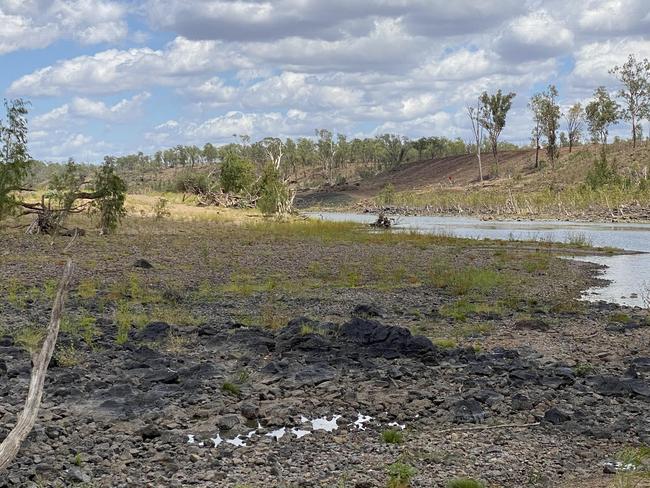 WEIR LOCATION: Rookwood Weir will span across the Fitzroy River where the cleared land and red markers were located in the distance.