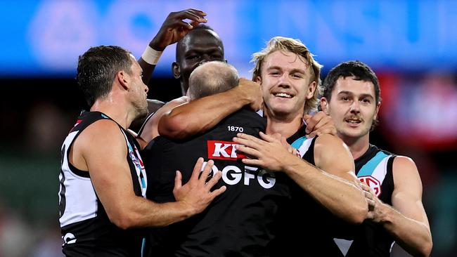 Ken Hinkley celebrates with his players after their close win in Sydney. (Photo by Brendon Thorne/AFL Photos/via Getty Images )