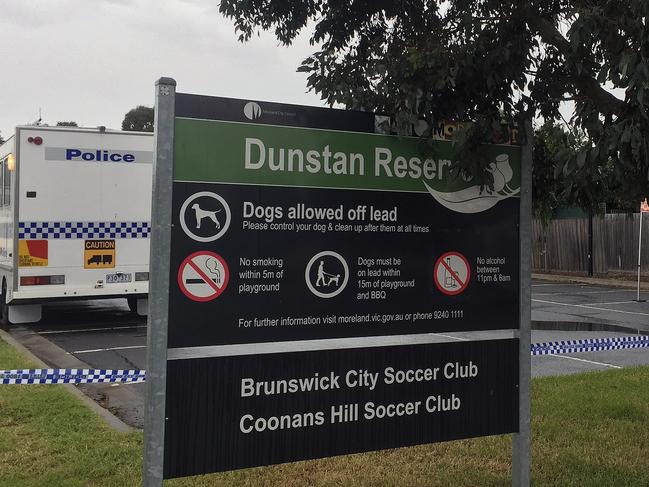 Police and State Emergency Services at the scene where a man's body was found at a reserve in Melbourne, Monday, July 3, 2017. A man in a designer suit and expensive shoes has been found dead at the end of a blood trail in a Melbourne park. His body was found near the Dunstan Reserve sports pavilion in Brunswick West by a resident on Monday morning and police are treating the death as a homicide. (AAP Image/Georgie Moore) NO ARCHIVING