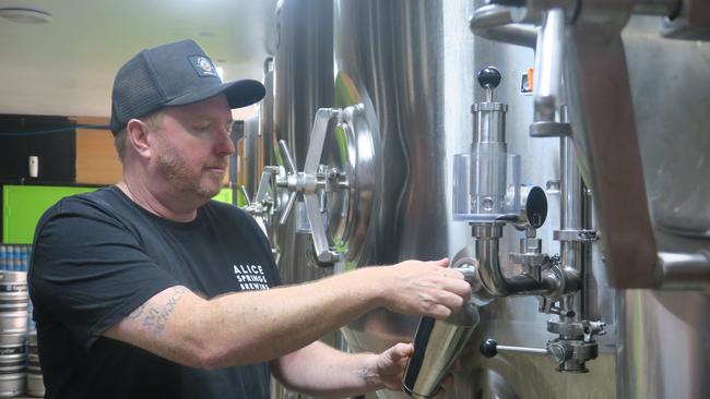 Alice Springs Brewing Co founder Kyle Pearson samples a new beer in preparation for the company's five year anniversary. Photo: Laura Hooper