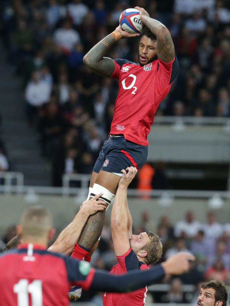 England's lock Courtney Lawes reaches for the ball during the friendly rugby union Test match between England and Italy at St James Park in Newcastle on September 6, 2019. (Photo by Lindsey Parnaby / AFP)