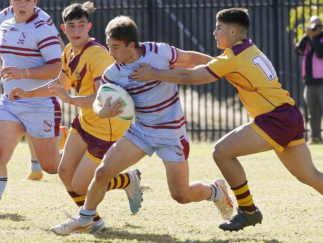 St Greg's Dylan Smith breaks through the Holy Cross line. Picture: John Appleyard