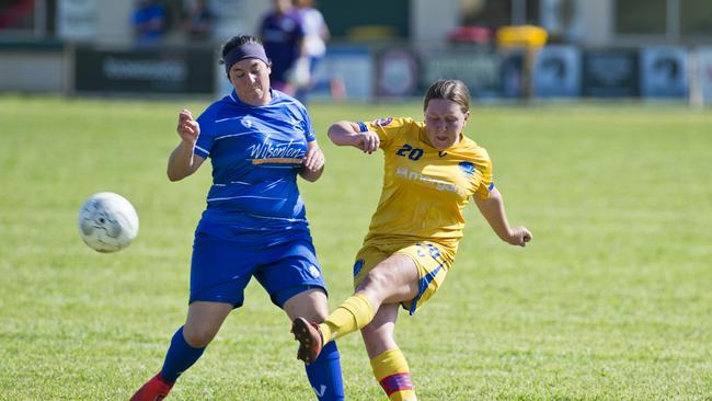 USQ FC’s Taylor Reeves (right) clears the ball ahead of Rockville’s Taylah Muggleton. USQ’s off-season recruitment makes them a legitimate Premier Women’s contender this season.