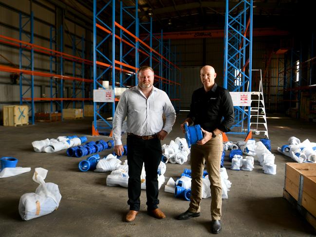 Aaron Power from Colliers Townsville with Clover Pipelines regional sales manager Clint Turner. Picture: Evan Morgan